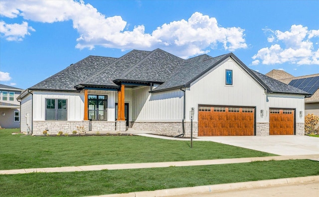 view of front facade with a front lawn and a garage