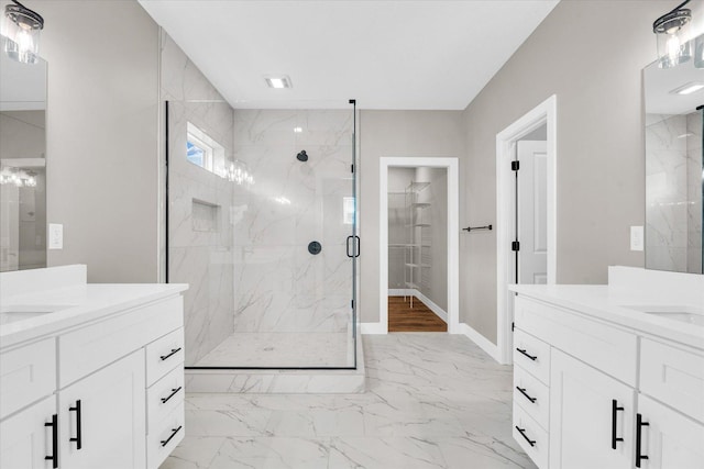 bathroom with walk in shower and vanity