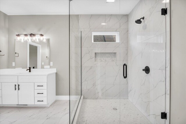 bathroom with vanity and a shower with shower door