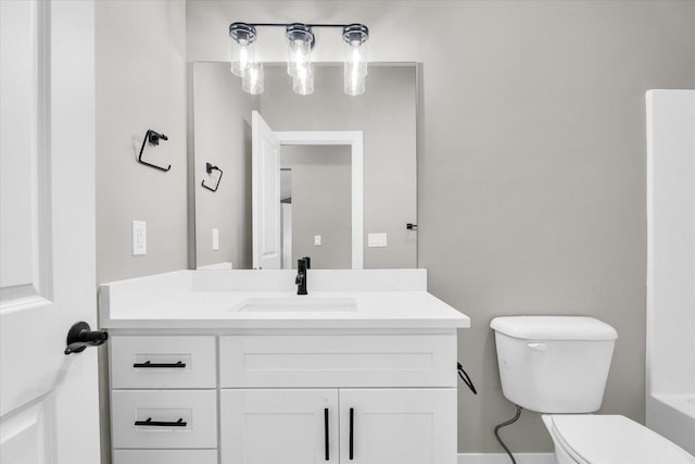 bathroom with toilet and vanity