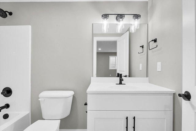 full bathroom with bathtub / shower combination, vanity, and toilet