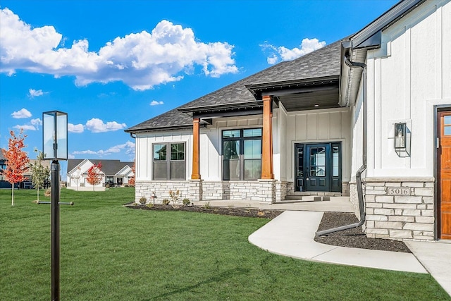 entrance to property featuring a yard