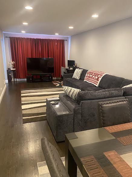 living room featuring dark hardwood / wood-style floors