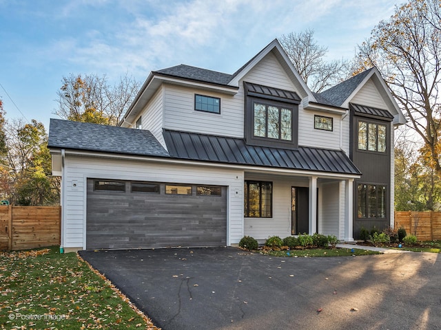 modern farmhouse style home featuring a garage