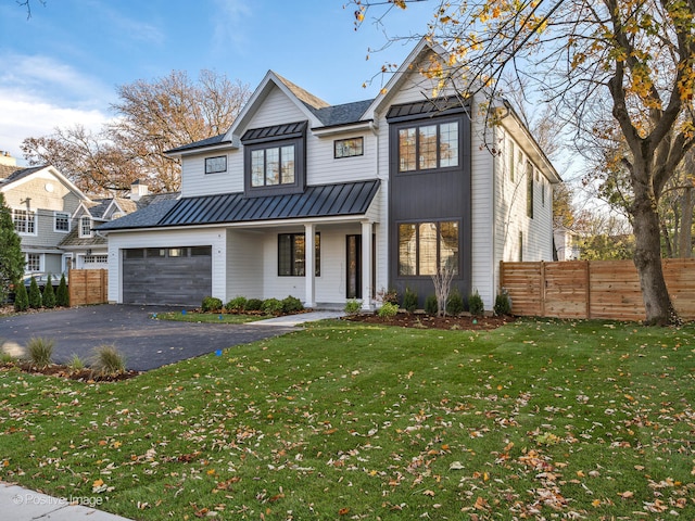 modern farmhouse with a garage and a front lawn