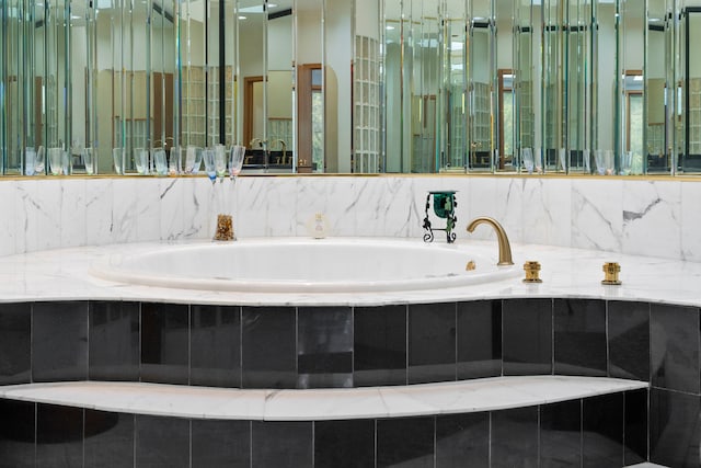 bathroom with tiled tub