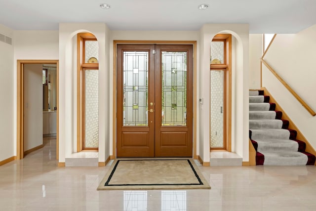 foyer entrance featuring french doors