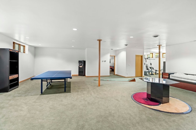 rec room with light colored carpet