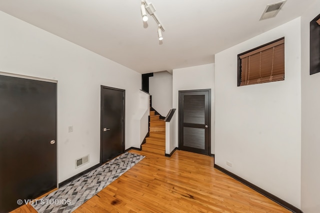 empty room with light hardwood / wood-style floors