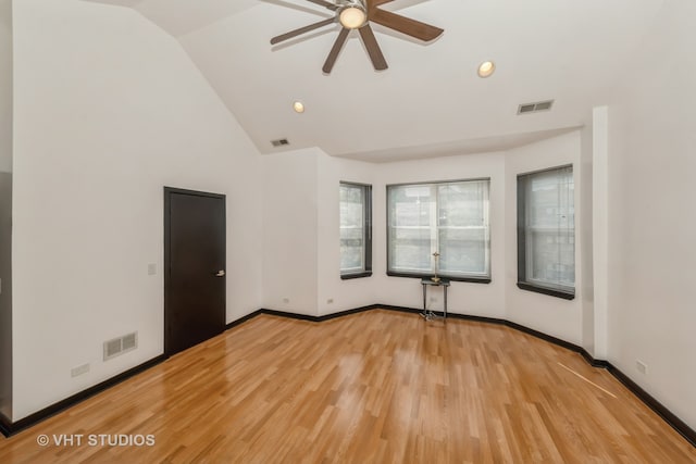 unfurnished room featuring ceiling fan, light wood-type flooring, and lofted ceiling