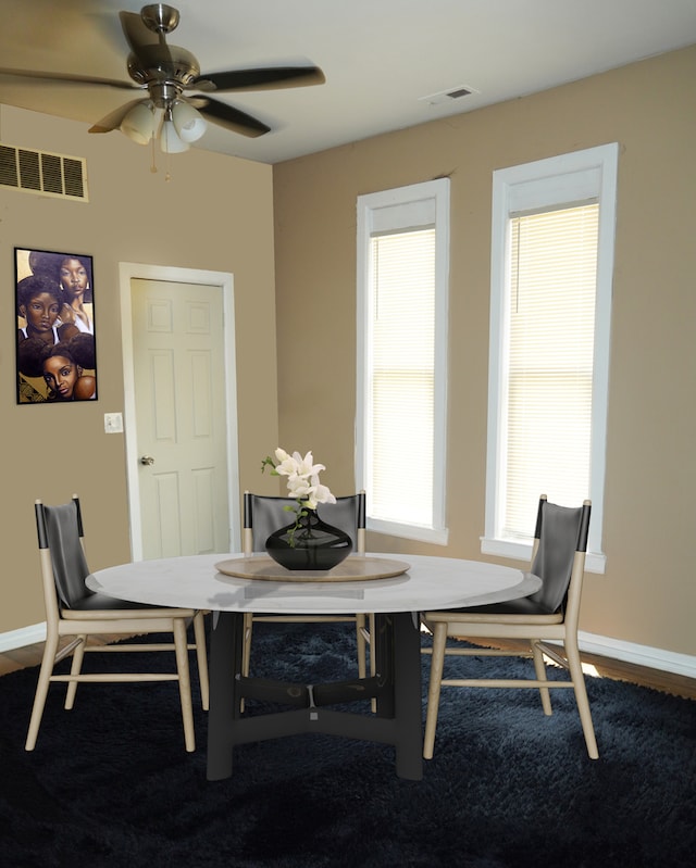 dining area featuring ceiling fan, hardwood / wood-style floors, and plenty of natural light