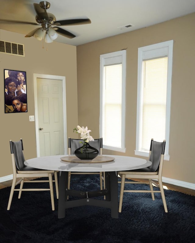 dining space with ceiling fan