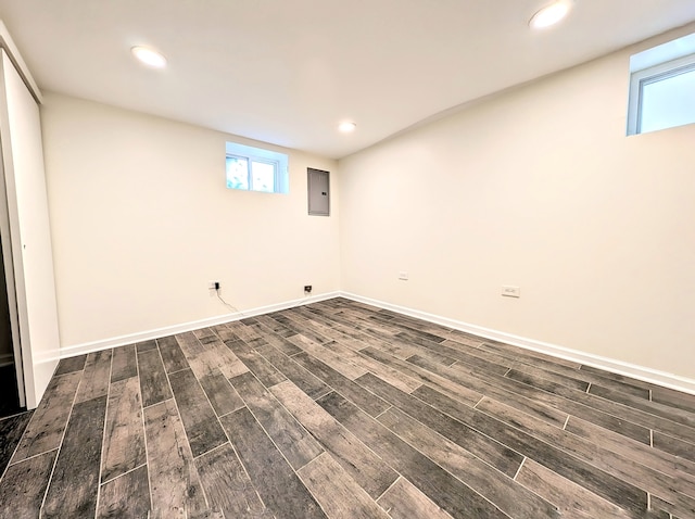 unfurnished room with dark wood-type flooring