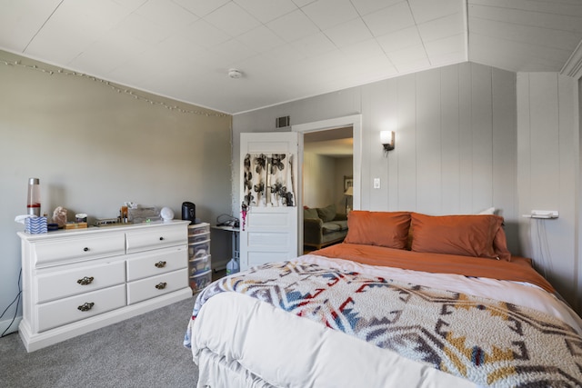 carpeted bedroom with vaulted ceiling