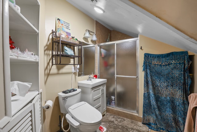 bathroom with vanity with extensive cabinet space, an enclosed shower, toilet, and vaulted ceiling