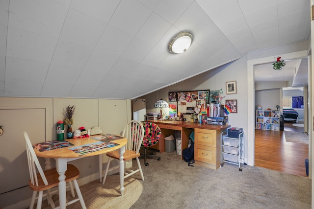 office with carpet and vaulted ceiling