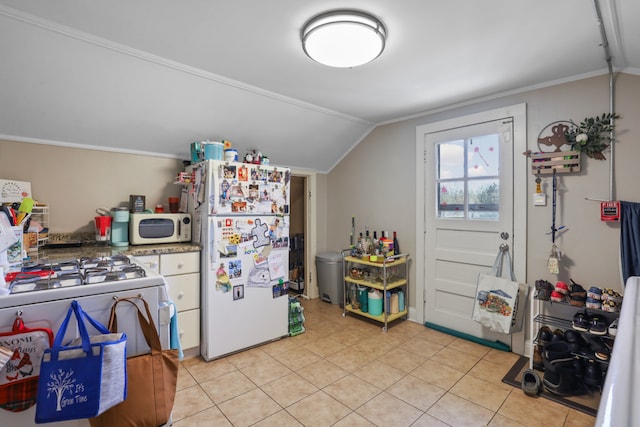 kitchen featuring white appliances, vaulted ceiling, and ornamental molding