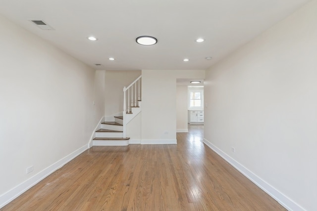 staircase featuring light hardwood / wood-style floors