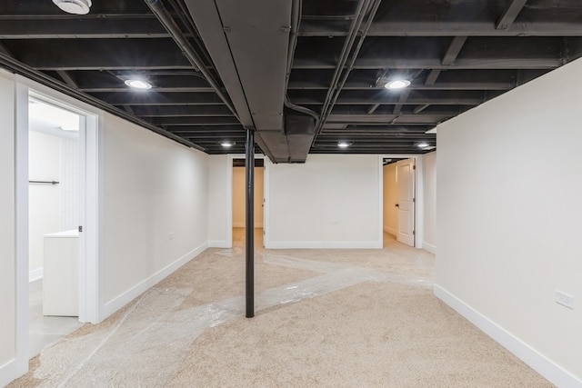 basement with light colored carpet