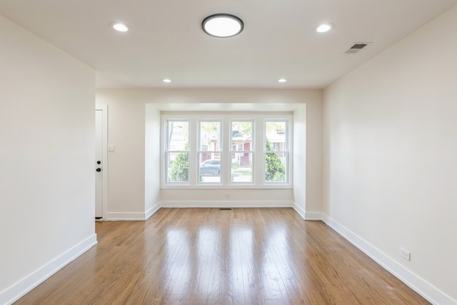 spare room featuring light wood-type flooring