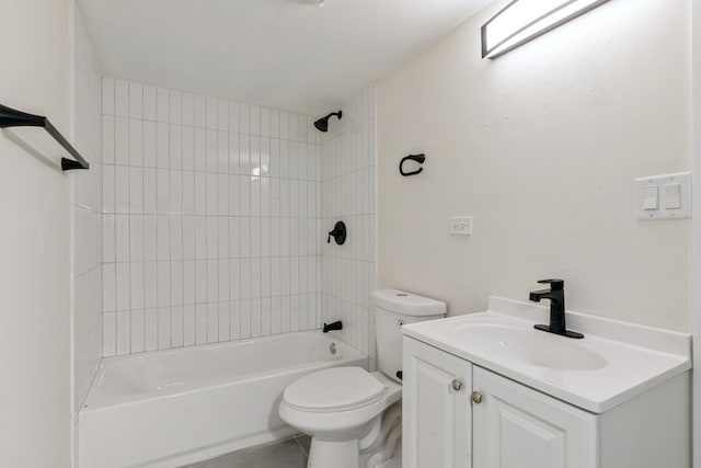 full bathroom with tiled shower / bath, vanity, and toilet