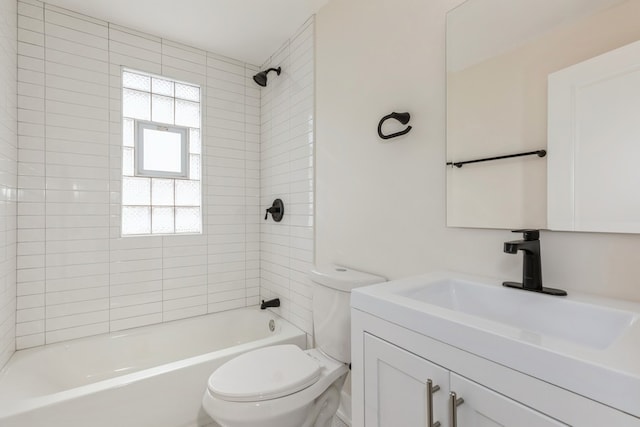 full bathroom with vanity with extensive cabinet space, tiled shower / bath combo, and toilet