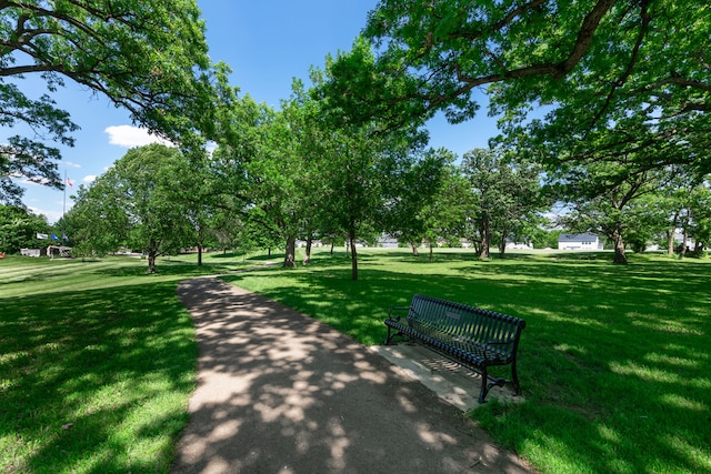 view of property's community with a yard