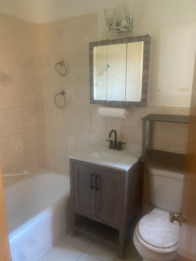 full bathroom featuring tile walls, toilet, vanity, bathtub / shower combination, and tile floors