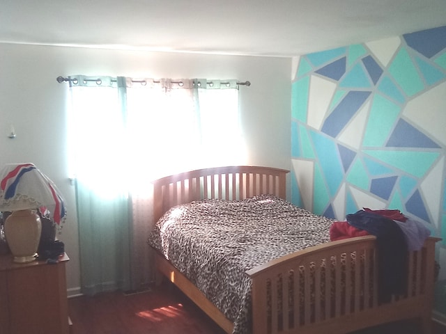 bedroom with wood-type flooring