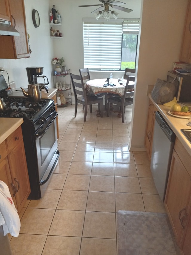 kitchen with gas stove, dishwasher, ceiling fan, and light tile floors