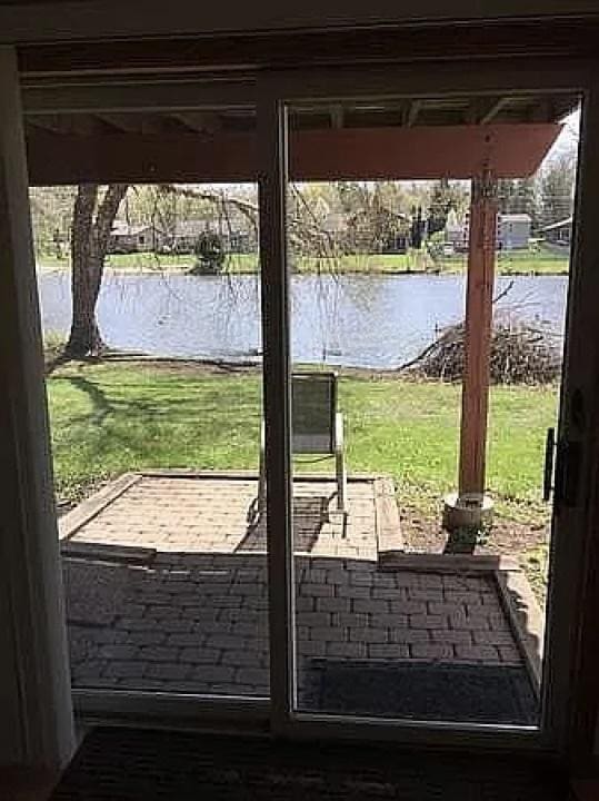 view of patio / terrace with a water view