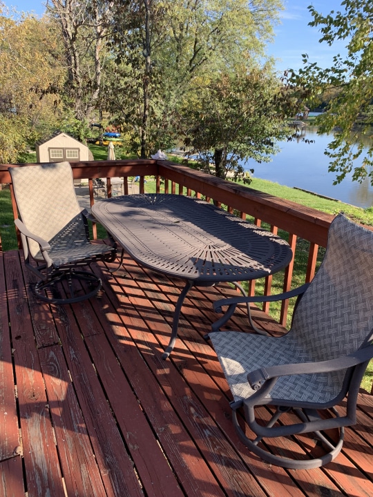 wooden terrace featuring a water view