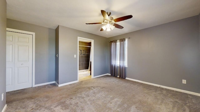 unfurnished bedroom featuring ceiling fan, carpet floors, a closet, and baseboards