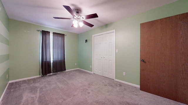 unfurnished bedroom featuring baseboards, ceiling fan, and light colored carpet