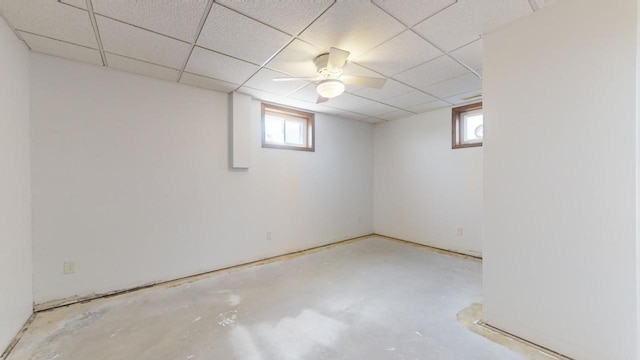 basement featuring a paneled ceiling