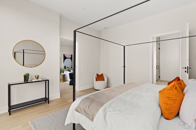 bedroom featuring light wood-type flooring