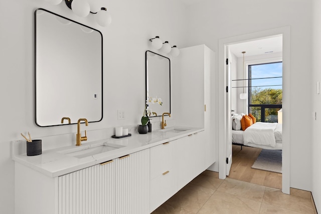 bathroom with tile patterned flooring and vanity