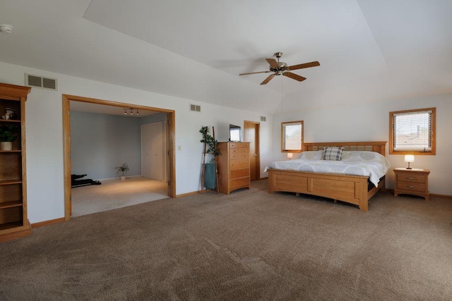 unfurnished bedroom with carpet floors, ceiling fan, and multiple windows