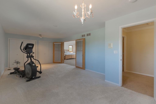 workout room featuring light colored carpet and a notable chandelier