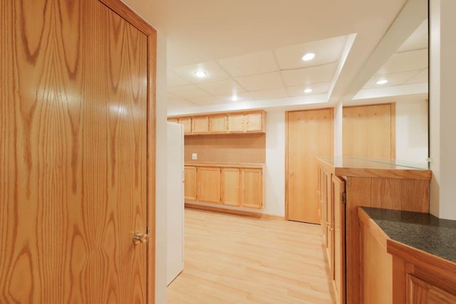 kitchen featuring light hardwood / wood-style floors and a paneled ceiling