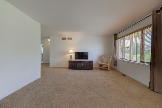 unfurnished room featuring light colored carpet