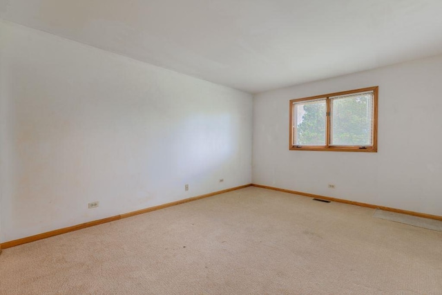 empty room featuring carpet flooring