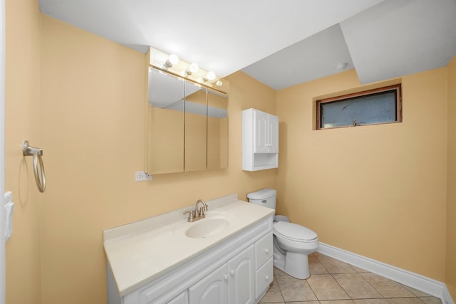 bathroom featuring vanity, toilet, and tile patterned floors