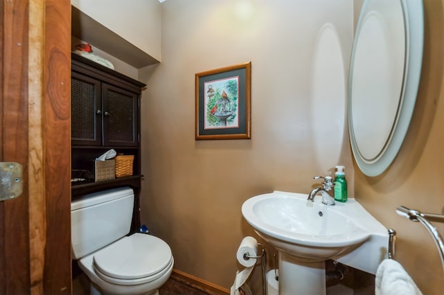 bathroom featuring toilet