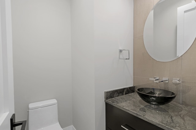 bathroom with vanity and toilet