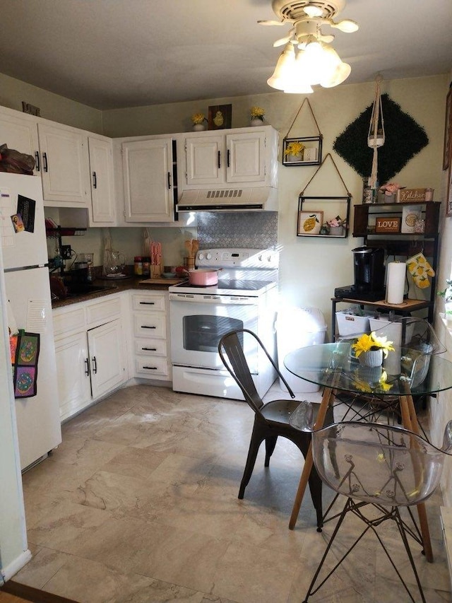 kitchen with ceiling fan, backsplash, white cabinets, and white appliances