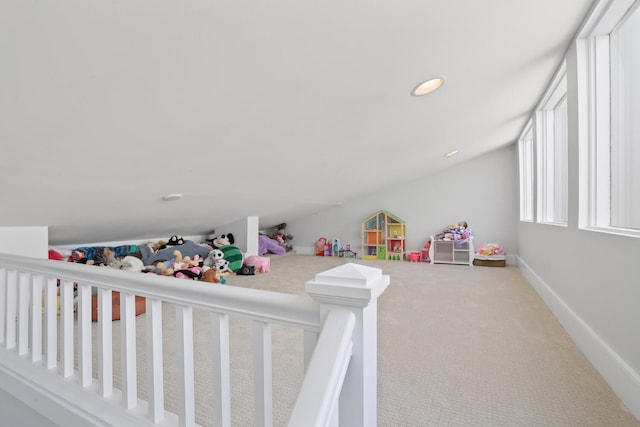 playroom featuring carpet flooring and lofted ceiling