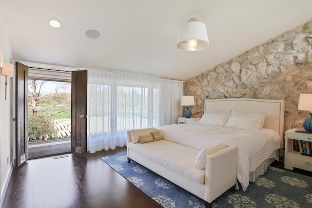 bedroom with dark wood-type flooring, access to outside, and multiple windows