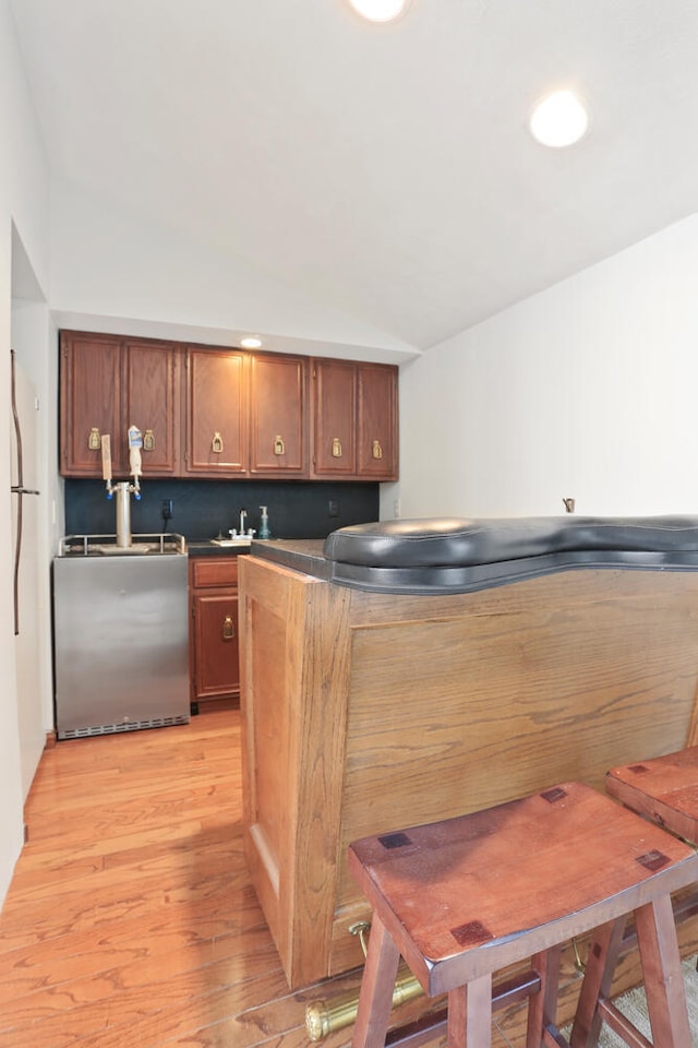 kitchen with dishwashing machine and light wood-type flooring