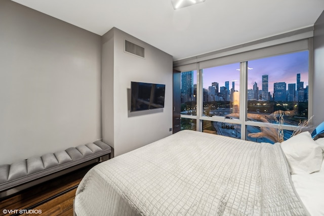 bedroom with wood-type flooring